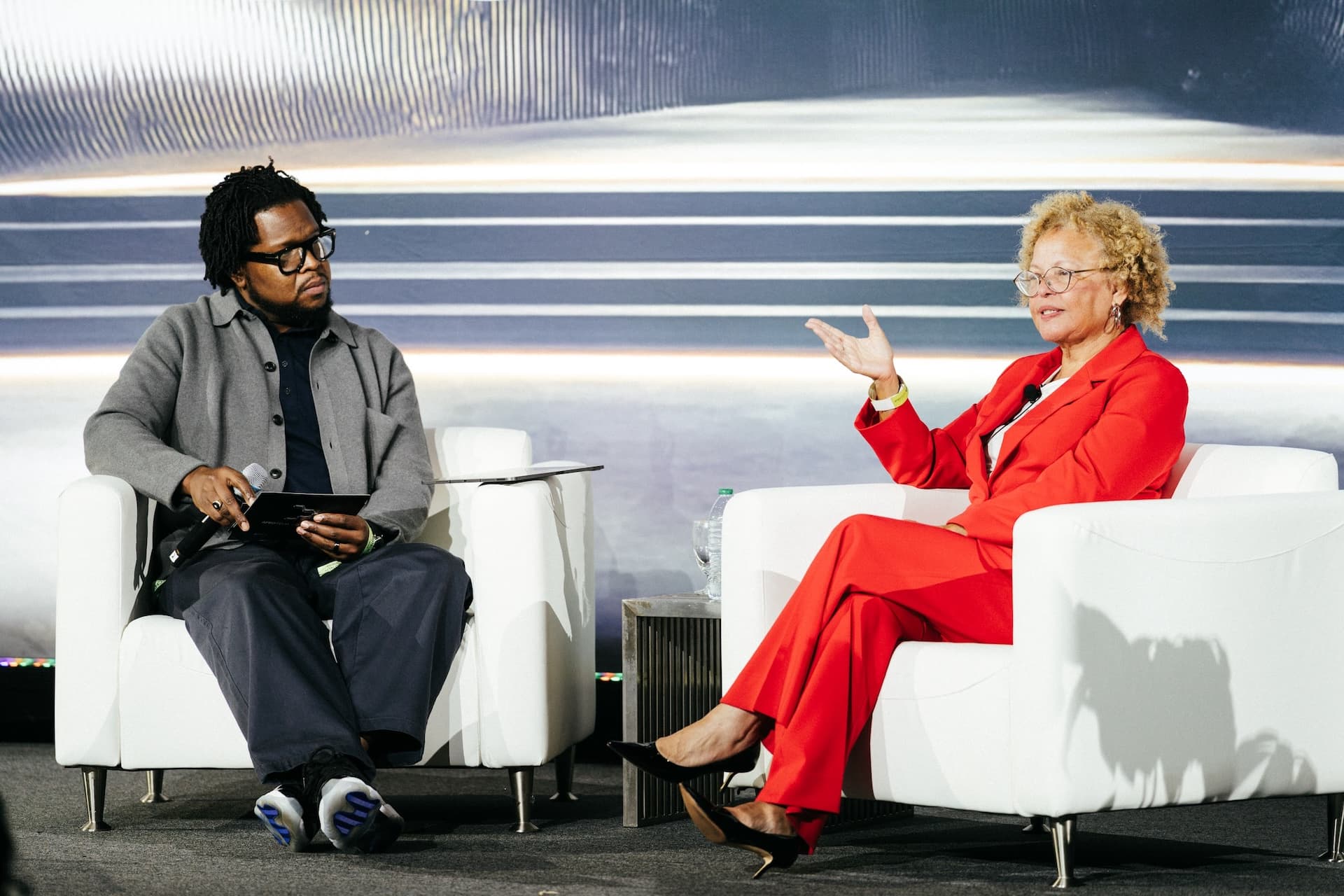 Will Lucas in conversation on stage with Debra Lee at AfroTech Conference 2025.